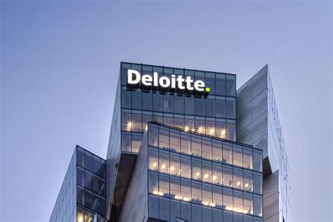 Deloitte name displayed on a modern office building